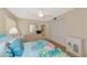 Bright bedroom showcases a dresser, closet, and coastal decor, creating a relaxing space at 4650 Ringwood Meadow # 37, Sarasota, FL 34235