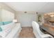 Bedroom featuring a daybed, neutral walls, tile flooring, and closet at 4650 Ringwood Meadow # 37, Sarasota, FL 34235