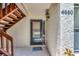 Charming front entrance featuring a decorative welcome mat, number display, and wooden stairs at 4650 Ringwood Meadow # 37, Sarasota, FL 34235