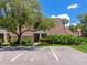 Inviting condo featuring lush landscaping and ample parking spaces for residents and visitors alike at 4650 Ringwood Meadow # 37, Sarasota, FL 34235