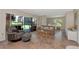 Cozy living room features neutral tones, comfortable seating, and a view to the outdoor patio at 4650 Ringwood Meadow # 37, Sarasota, FL 34235