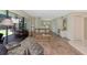 Inviting living room with sliding glass doors to patio, neutral decor, and plenty of natural light at 4650 Ringwood Meadow # 37, Sarasota, FL 34235