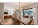 Open dining room boasts natural light with access and views to the lanai and pool at 4917 Leatha Ln, Sarasota, FL 34232
