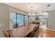 Bright dining room with a view of the pool area and connection to the kitchen at 4917 Leatha Ln, Sarasota, FL 34232