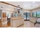 Open kitchen with granite countertops, tile floor, and access to the pool and dining room at 4917 Leatha Ln, Sarasota, FL 34232