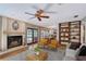 Open living room with fireplace and wood floors flows into the dining and kitchen areas at 4917 Leatha Ln, Sarasota, FL 34232