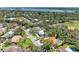 Aerial view of a residential community with well-manicured lawns and mature trees at 5223 Shadow Lawn Dr, Sarasota, FL 34242