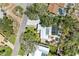 Aerial view of the property and surrounding homes showing the pool and nice landscaping at 5223 Shadow Lawn Dr, Sarasota, FL 34242