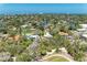 Breathtaking aerial view showcasing lush tropical foliage, waterways, and nearby coastal community at 5223 Shadow Lawn Dr, Sarasota, FL 34242