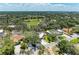 Aerial view of the property nestled among lush greenery and landscaping in a quiet neighborhood at 5223 Shadow Lawn Dr, Sarasota, FL 34242