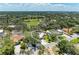 Aerial view of the property nestled among lush greenery and landscaping in a quiet neighborhood at 5223 Shadow Lawn Dr, Sarasota, FL 34242