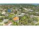 Scenic aerial view of a residential area showcasing lush landscaping and waterfront access at 5223 Shadow Lawn Dr, Sarasota, FL 34242