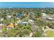 Beautiful aerial view of the waterfront community featuring lush greenery and stunning waterfront homes at 5223 Shadow Lawn Dr, Sarasota, FL 34242