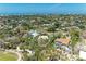 Overhead view of a residential community with well-maintained lawns and mature trees at 5223 Shadow Lawn Dr, Sarasota, FL 34242