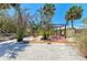 This spacious backyard features brick pavers, gravel and a charming hammock at 5223 Shadow Lawn Dr, Sarasota, FL 34242