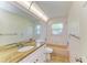 Bathroom featuring a granite vanity, neutral tile and a shower-tub combo at 5223 Shadow Lawn Dr, Sarasota, FL 34242