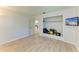 Bright bedroom with wood floors, closet and a mounted television at 5223 Shadow Lawn Dr, Sarasota, FL 34242