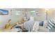 The staged bedroom features a playful design with lots of light at 5223 Shadow Lawn Dr, Sarasota, FL 34242