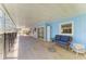 The covered patio features comfortable seating options for relaxing outdoors at 5223 Shadow Lawn Dr, Sarasota, FL 34242