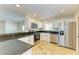 Updated kitchen features granite counters, stainless appliances, and an eat-in bar at 5223 Shadow Lawn Dr, Sarasota, FL 34242