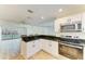 Modern kitchen area featuring stainless steel appliances and beautiful countertops at 5223 Shadow Lawn Dr, Sarasota, FL 34242