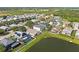 Expansive community aerial view with a lake, showcasing the home's proximity to water and neighboring properties at 5224 58Th E Ter, Bradenton, FL 34203