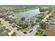 Stunning aerial view of the property backing onto a serene lake in a well-maintained residential neighborhood at 5224 58Th E Ter, Bradenton, FL 34203