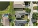 Bird's eye view of the neighborhood, showcasing the home's backyard, neighboring houses, and nearby pond at 5224 58Th E Ter, Bradenton, FL 34203