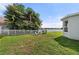 Fenced in backyard with a swing set and a view of the lake at 5224 58Th E Ter, Bradenton, FL 34203