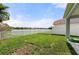 Spacious backyard with lush green grass and beautiful lake views at 5224 58Th E Ter, Bradenton, FL 34203