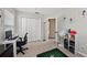 An organized bedroom featuring a closet, a computer desk, and natural light at 5224 58Th E Ter, Bradenton, FL 34203