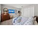 Cozy bedroom with a television, dresser, closet, and patterned bedding at 5224 58Th E Ter, Bradenton, FL 34203