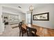 Bright dining room featuring a wooden table, chandelier, and large mirror at 5224 58Th E Ter, Bradenton, FL 34203
