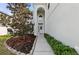 Charming home entrance with a well-maintained walkway, landscaping, and an inviting covered entryway at 5224 58Th E Ter, Bradenton, FL 34203