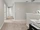 Upstairs hallway with carpet, neutral paint, and doorways leading to rooms at 5224 58Th E Ter, Bradenton, FL 34203