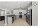 Spacious kitchen with stainless appliances, granite counters and white cabinets at 5224 58Th E Ter, Bradenton, FL 34203