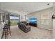 Living room with neutral carpet, ceiling fan and sliding door to patio at 5224 58Th E Ter, Bradenton, FL 34203