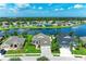 Expansive aerial view of homes with lush landscaping and a serene lake, offering a peaceful neighborhood setting at 5319 120Th E Ave, Parrish, FL 34219