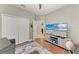 Inviting bedroom with wood floors, a closet, and an open door to the bathroom, creating a connected space at 5319 120Th E Ave, Parrish, FL 34219