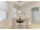 Cozy dining area features a round table and chairs, lots of natural light, and modern lighting fixtures at 5319 120Th E Ave, Parrish, FL 34219