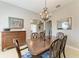 Bright dining room featuring tile flooring, a buffet table, and an ornate chandelier at 5319 120Th E Ave, Parrish, FL 34219