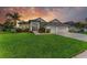 Beautiful single-story home featuring a well-manicured lawn and lush landscaping at 5319 120Th E Ave, Parrish, FL 34219