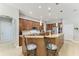 Spacious kitchen features granite countertops, breakfast bar, stainless steel appliances, and wooden cabinets at 5319 120Th E Ave, Parrish, FL 34219