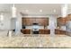 Modern kitchen features granite countertops, stainless steel appliances, and wooden cabinets at 5319 120Th E Ave, Parrish, FL 34219