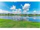 Enjoy waterfront living with this picturesque lake view, set against a backdrop of well-maintained homes at 5319 120Th E Ave, Parrish, FL 34219