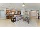 Open concept living room with breakfast bar, comfortable seating, and lots of natural light at 5319 120Th E Ave, Parrish, FL 34219