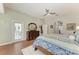 Spacious main bedroom showcases wood floors, direct patio access, and decorative dresser with mirror at 5319 120Th E Ave, Parrish, FL 34219