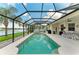 Take a dip in this screened-in pool and enjoy the outdoor dining area, all with a peaceful lake view at 5319 120Th E Ave, Parrish, FL 34219