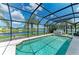 Bask in the Florida sun in this screened-in pool and hot tub, set against a tranquil lake backdrop at 5319 120Th E Ave, Parrish, FL 34219