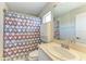 Bathroom featuring a vanity, mirror, toilet, shower/tub combination, and blue paint at 5420 River Sound Ter, Bradenton, FL 34208